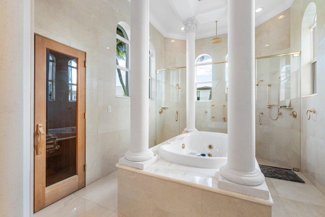 bathroom featuring ornate columns, ornamental molding, shower with separate bathtub, and tile walls