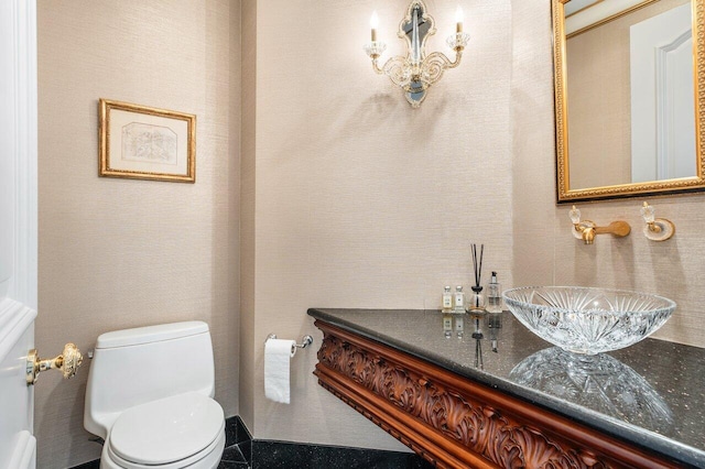 bathroom featuring sink and toilet