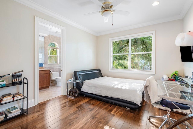 bedroom with ceiling fan, dark hardwood / wood-style flooring, ensuite bath, and multiple windows