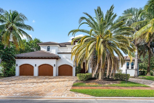 mediterranean / spanish-style home featuring a balcony