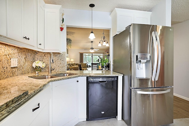 kitchen with white cabinets, dishwasher, stainless steel refrigerator with ice dispenser, and a textured ceiling