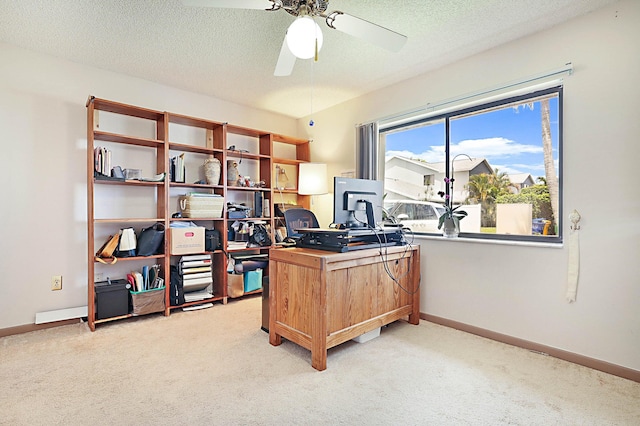 office with ceiling fan, a textured ceiling, and light carpet