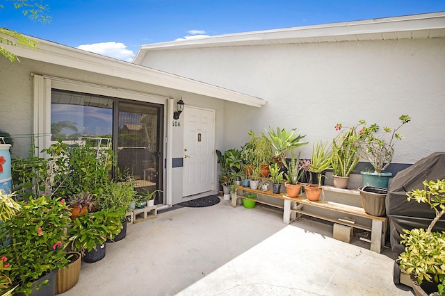 doorway to property with a patio area