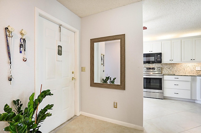 interior space featuring a textured ceiling