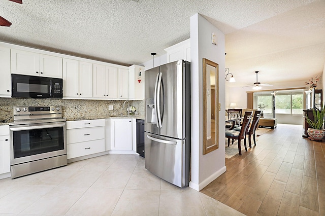 kitchen with black appliances, white cabinets, ceiling fan, tasteful backsplash, and decorative light fixtures