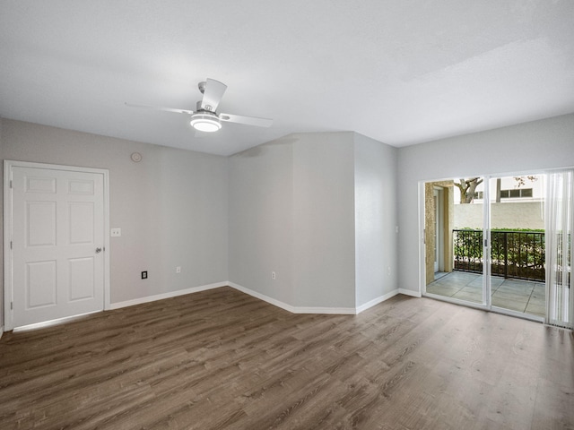 spare room with dark hardwood / wood-style floors and ceiling fan