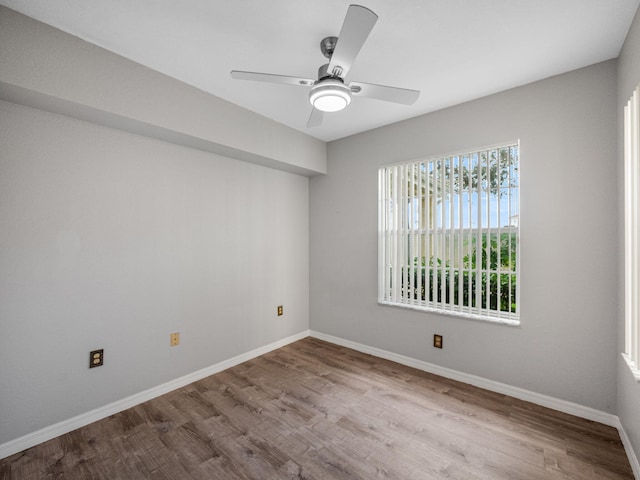 unfurnished room with ceiling fan and light hardwood / wood-style flooring