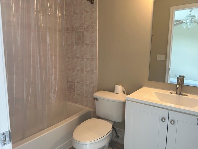 full bathroom with shower / bathtub combination with curtain, toilet, ceiling fan, and vanity