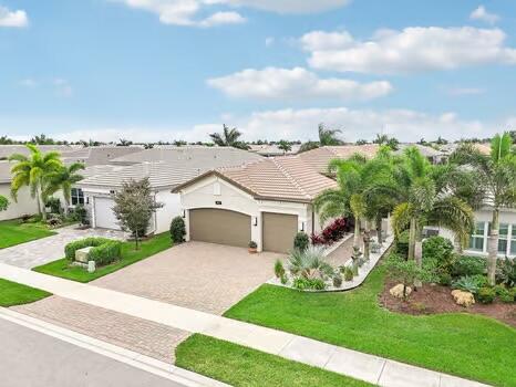 view of front of home featuring a garage and a front lawn