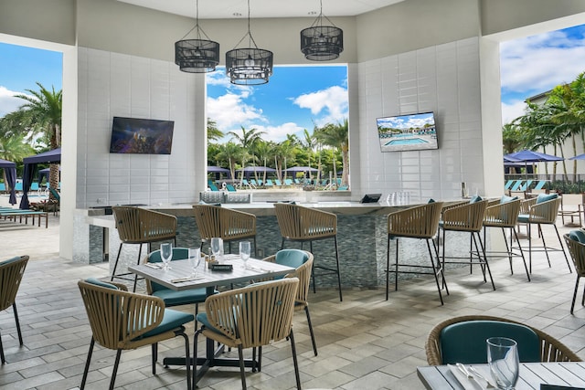 view of patio featuring an outdoor bar