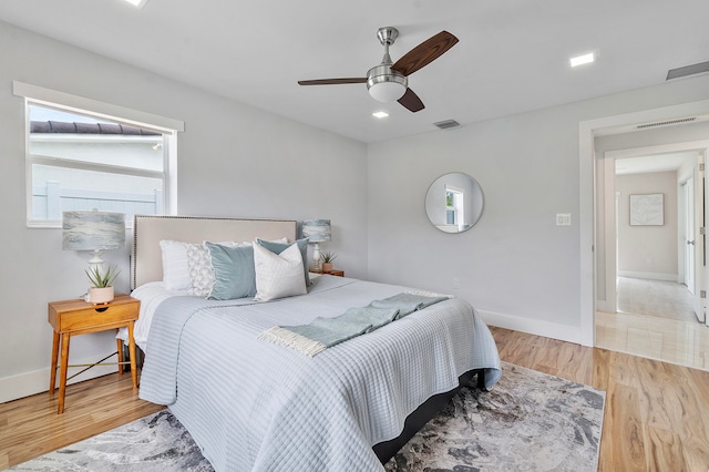 bedroom featuring ceiling fan and light hardwood / wood-style floors