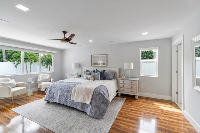 bedroom with hardwood / wood-style floors and ceiling fan