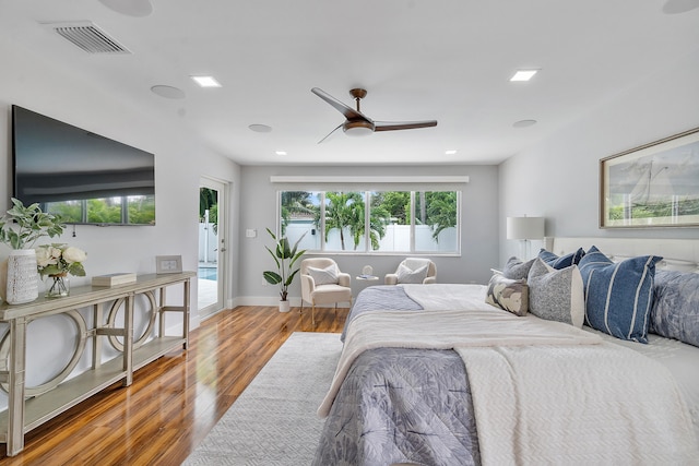 bedroom featuring access to exterior, ceiling fan, and wood-type flooring