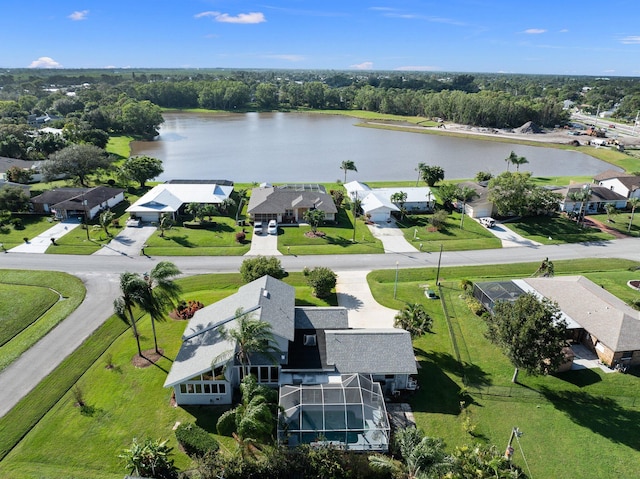 bird's eye view with a residential view and a water view