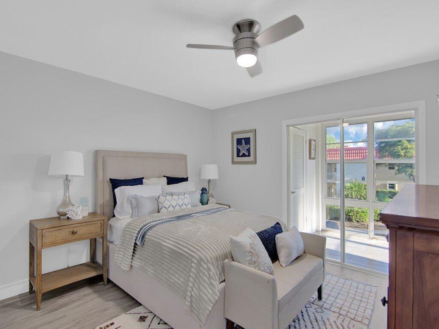 bedroom featuring light wood-type flooring, access to outside, and ceiling fan