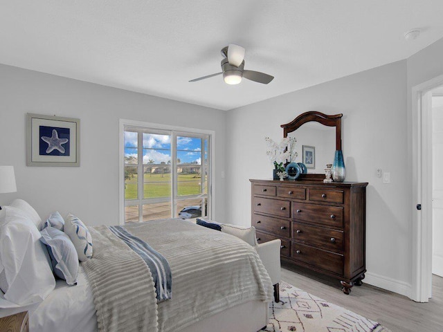 bedroom featuring light hardwood / wood-style floors and ceiling fan