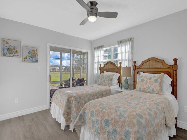 bedroom featuring access to outside, ceiling fan, and light hardwood / wood-style flooring