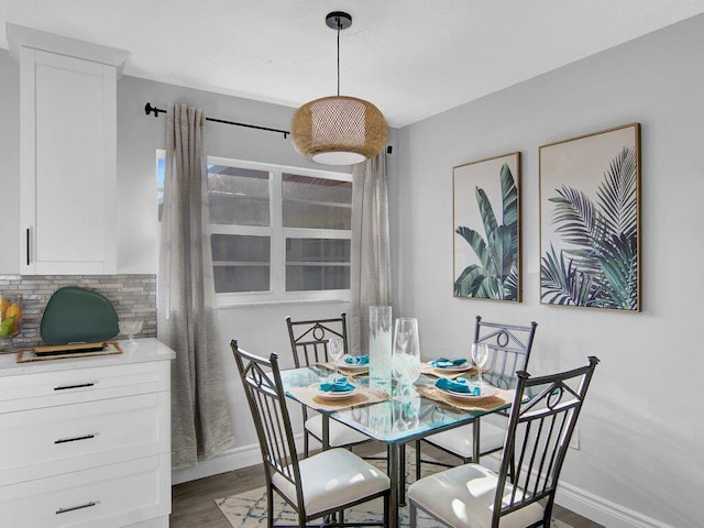 dining space featuring dark hardwood / wood-style floors