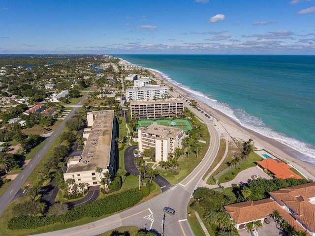 bird's eye view featuring a water view and a view of the beach