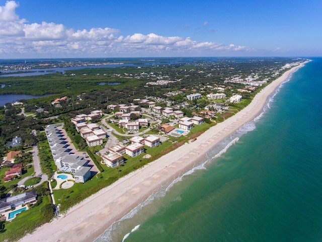 drone / aerial view with a view of the beach and a water view