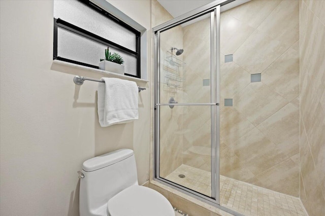 bathroom with toilet and walk in shower