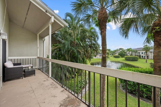 balcony featuring a water view