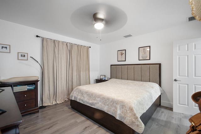 bedroom featuring light hardwood / wood-style flooring and ceiling fan