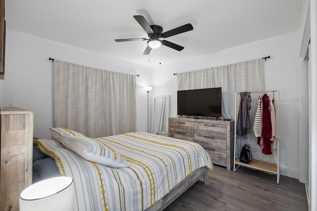 bedroom featuring dark hardwood / wood-style floors and ceiling fan