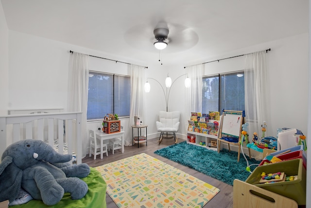 recreation room featuring hardwood / wood-style floors and ceiling fan