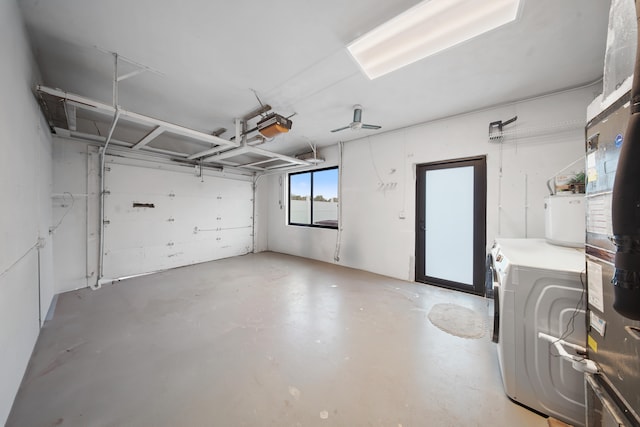 garage featuring a garage door opener and washing machine and clothes dryer