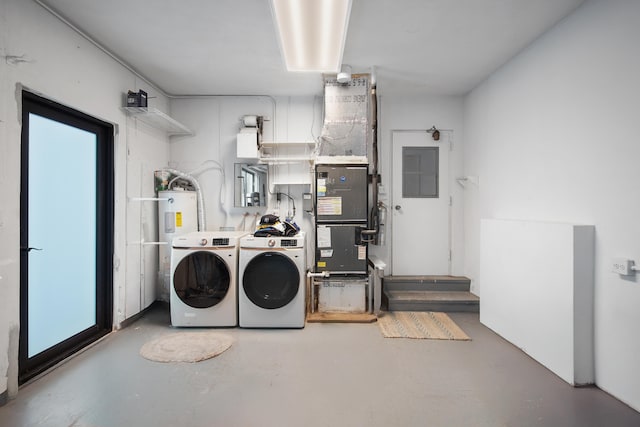 clothes washing area with electric water heater and washing machine and clothes dryer