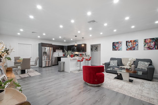 living room featuring light hardwood / wood-style floors