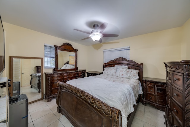 tiled bedroom with ceiling fan