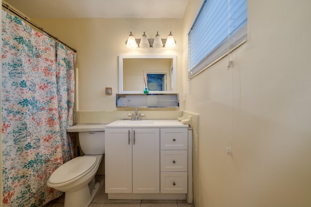 bathroom with tile patterned floors, vanity, and toilet