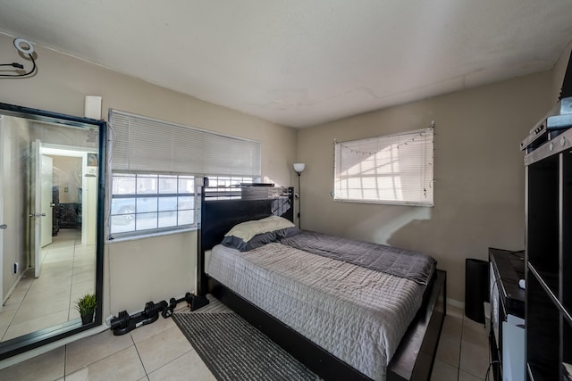 bedroom with light tile patterned flooring