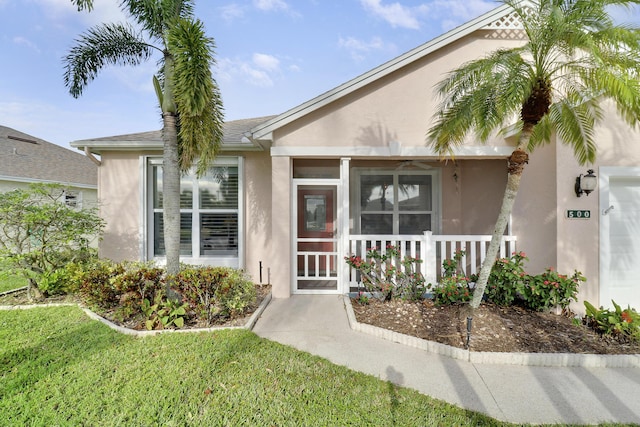 entrance to property with a yard