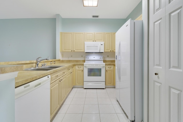 kitchen with light brown cabinets, white appliances, sink, and light tile patterned floors