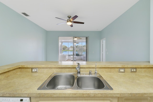 kitchen featuring sink and white dishwasher