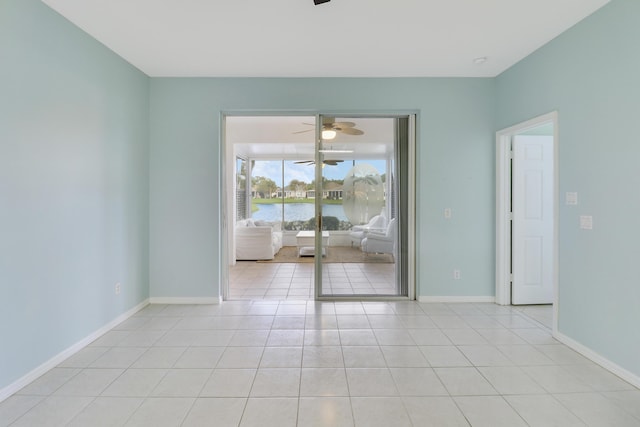 tiled empty room with a water view