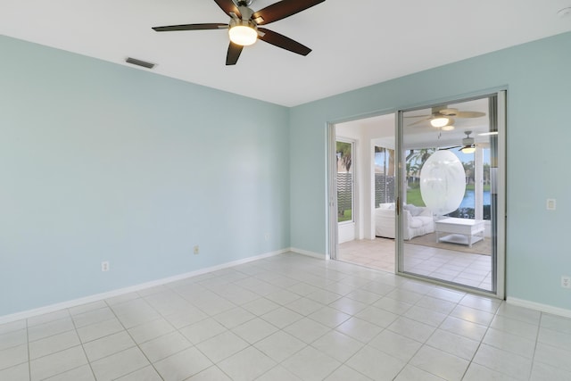 unfurnished room featuring light tile patterned flooring