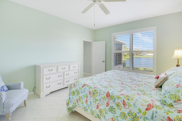 bedroom featuring ceiling fan and light tile patterned flooring