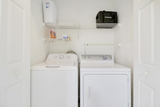 laundry area with separate washer and dryer