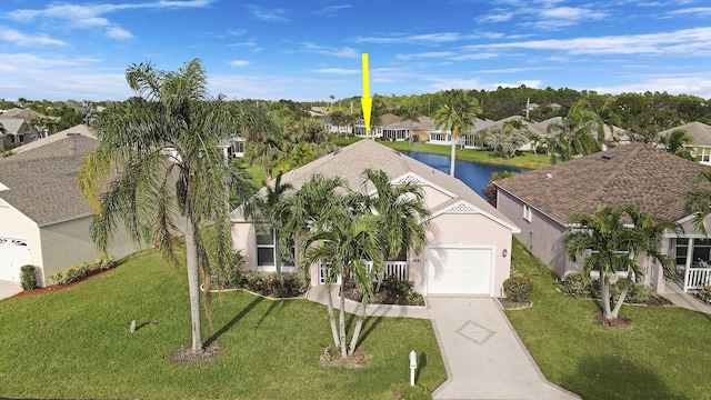 birds eye view of property featuring a water view