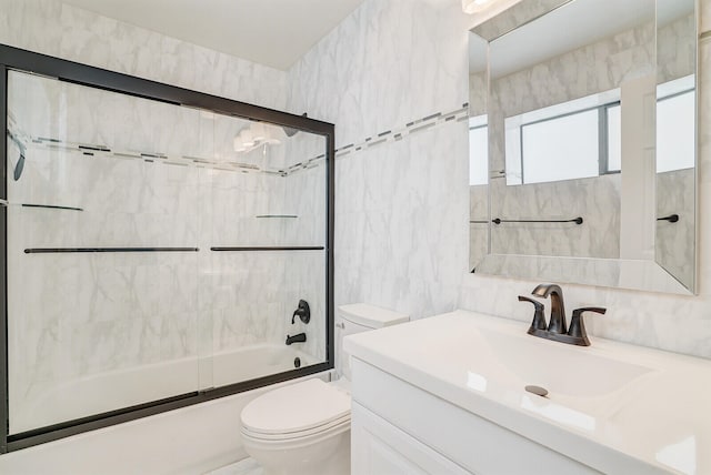 full bathroom featuring decorative backsplash, vanity, tile walls, enclosed tub / shower combo, and toilet