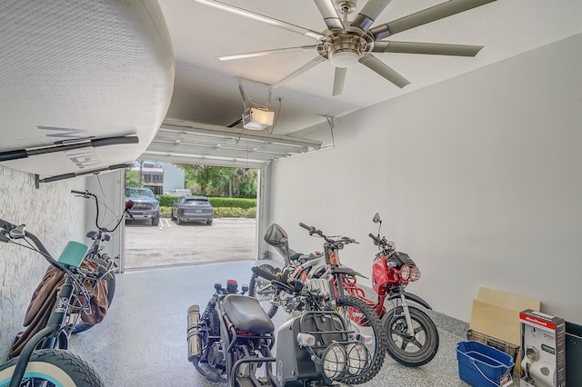 garage with ceiling fan and a garage door opener