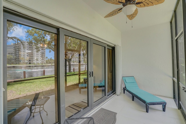 sunroom featuring ceiling fan