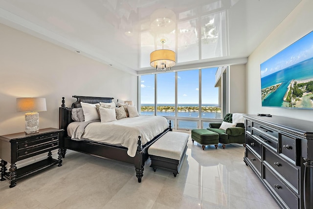 bedroom featuring a wall of windows