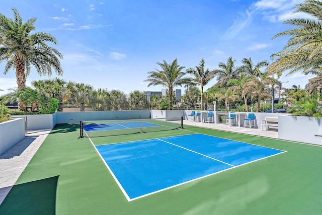 view of sport court with basketball hoop