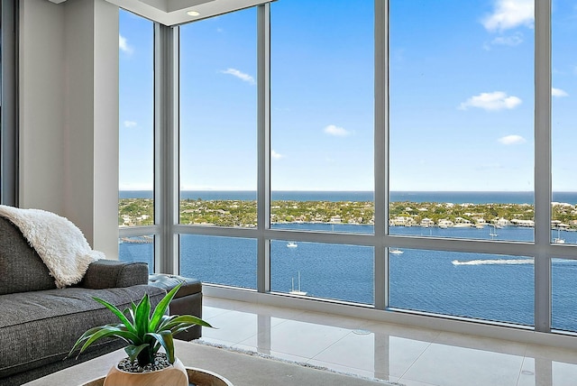 interior space with a wealth of natural light and a water view