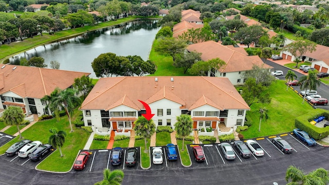 birds eye view of property featuring a water view